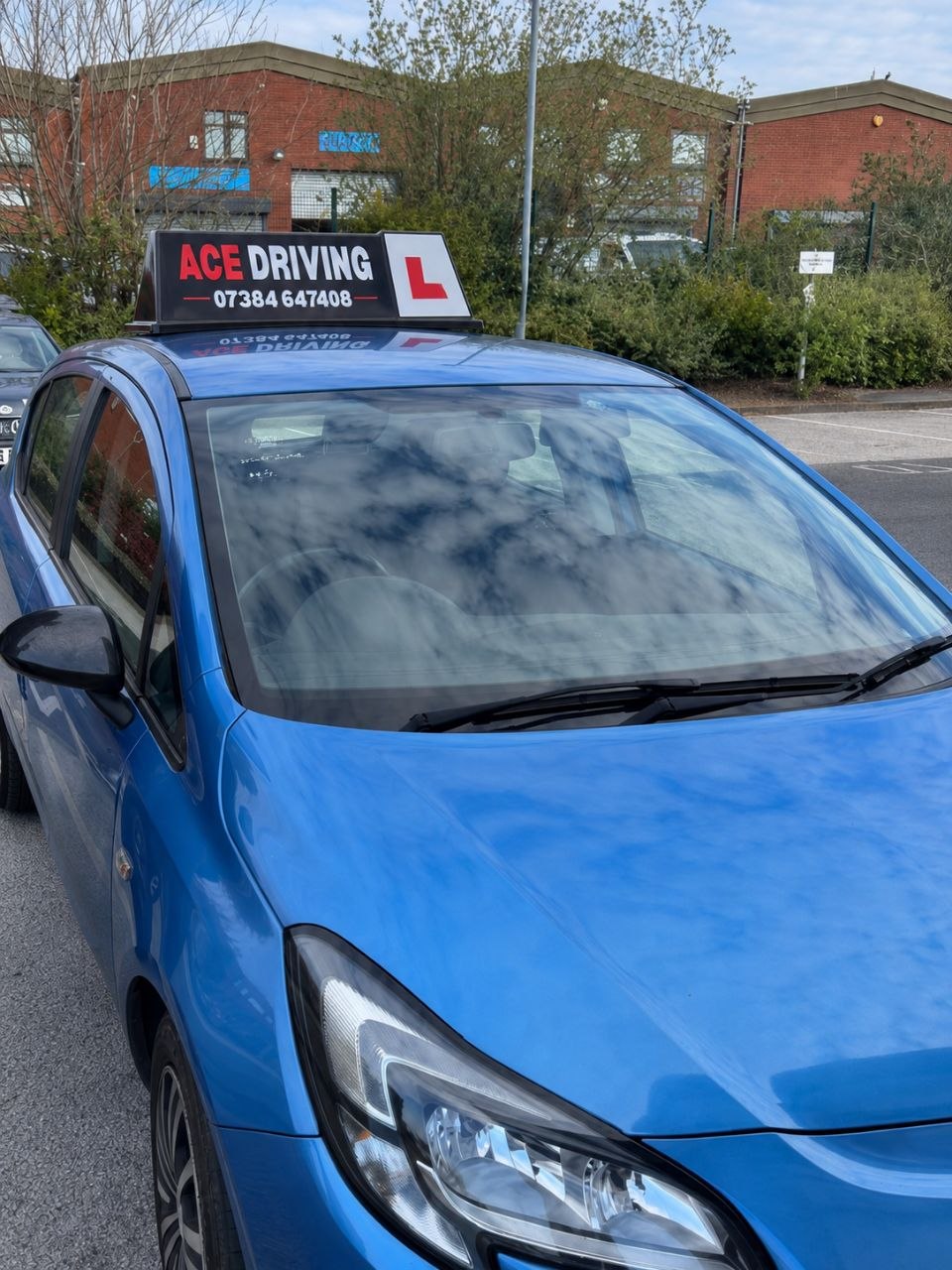Abdullah — manual instructor, blue Vauxhall Corsa